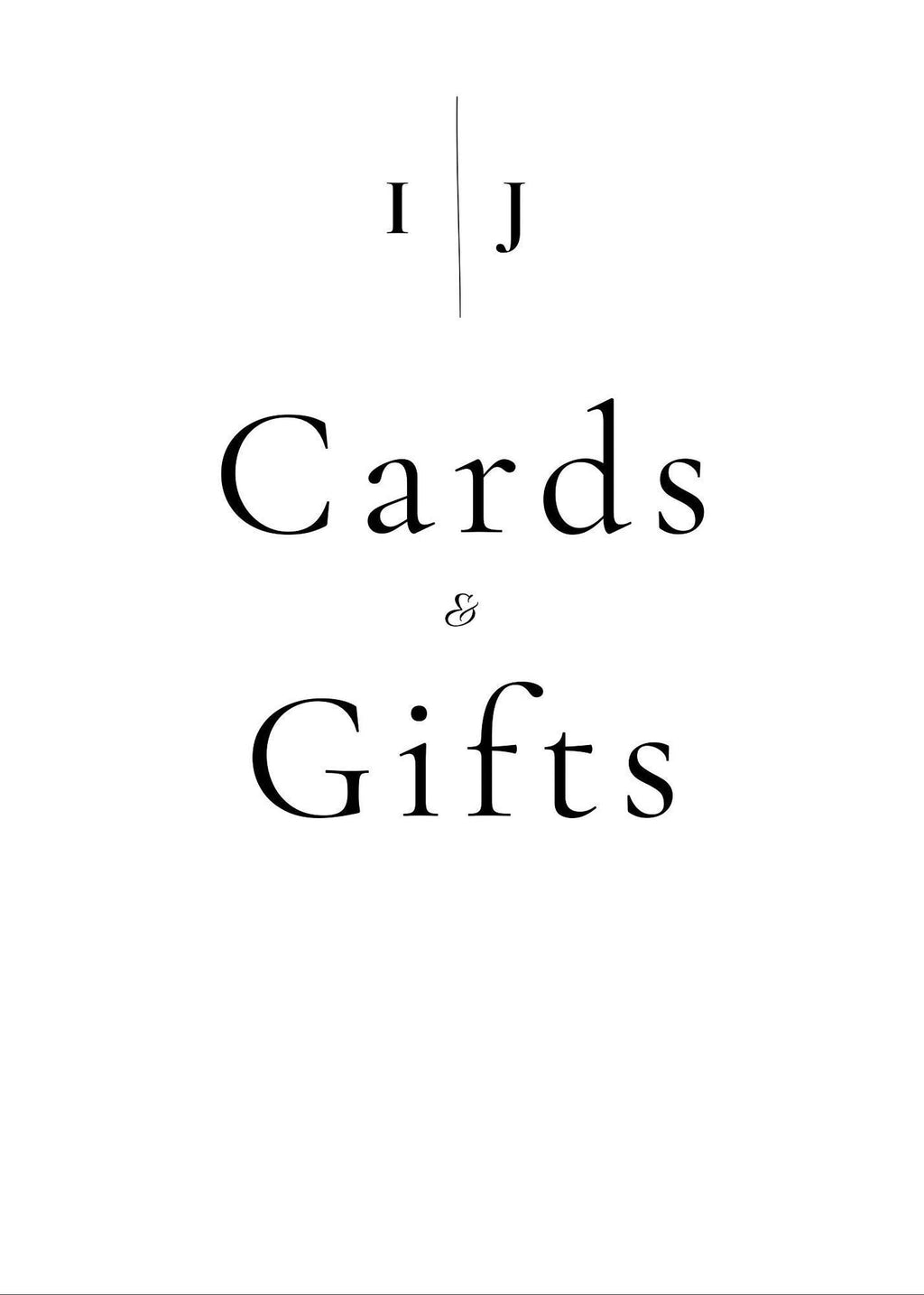A white sign with black text reading "I J" separated by a vertical line, and below that, "Cards & Gifts."