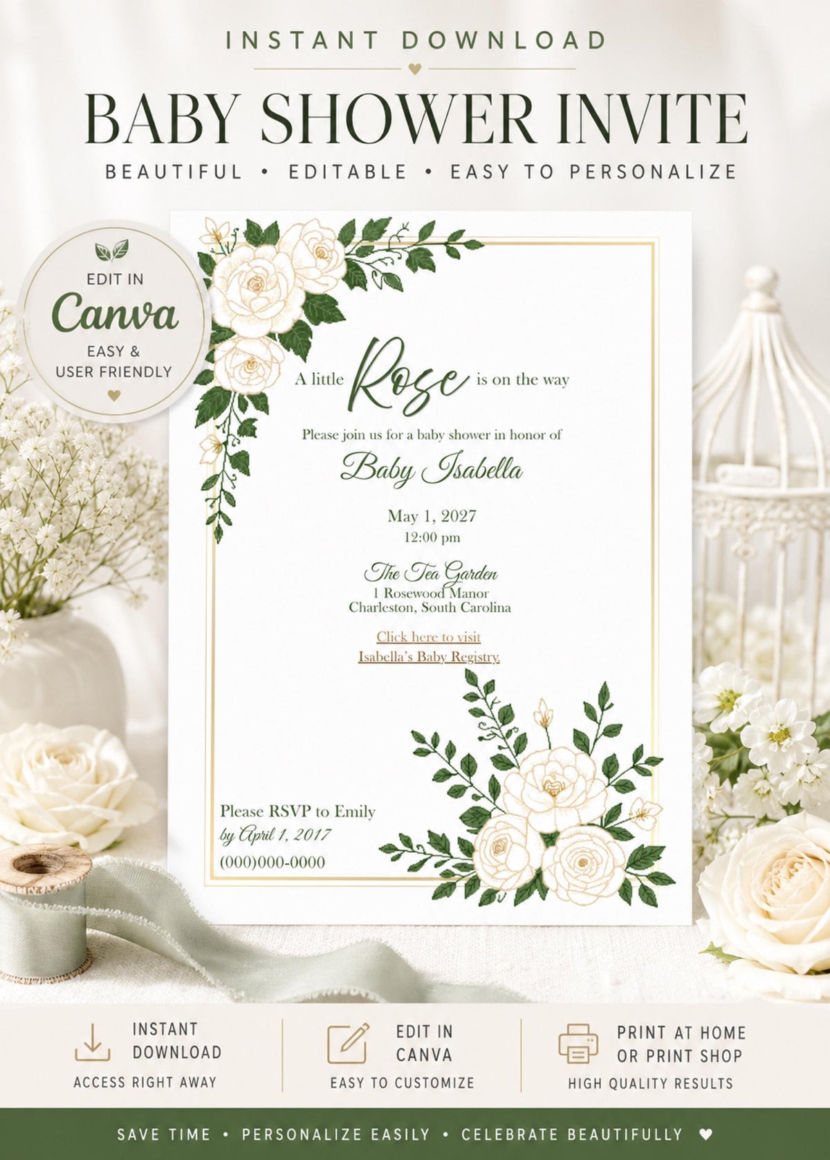 A white baby shower invitation with gold trim and white roses with green leaves in the top left and bottom right corners, shown on a white table with a white floral arrangement and a white birdcage.