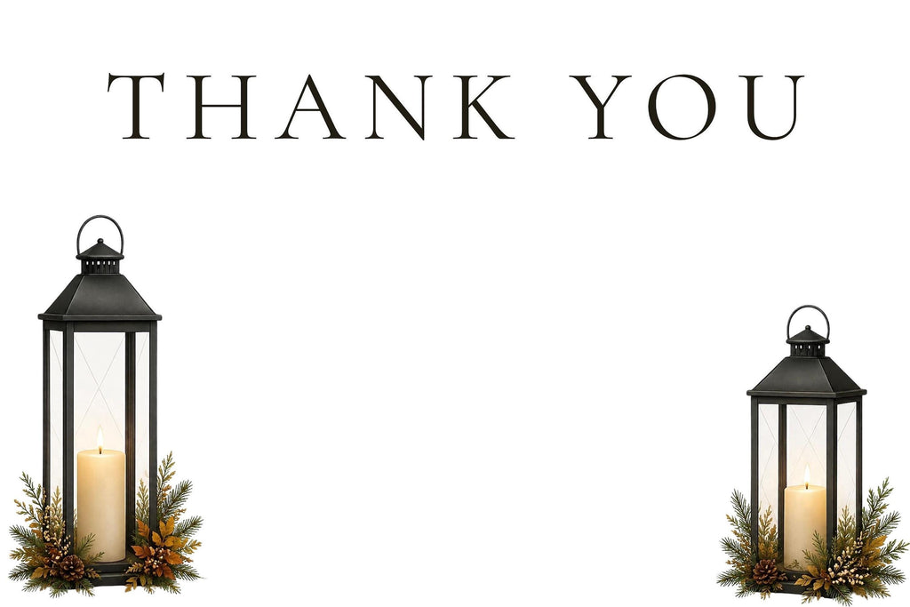 A white thank you card with black text, flanked by two black lanterns with lit candles and pine foliage at their bases.