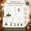 A flat lay of various wedding invitation suite cards, some with evergreen trees, lanterns, or floral accents, surrounded by candles and autumn foliage.