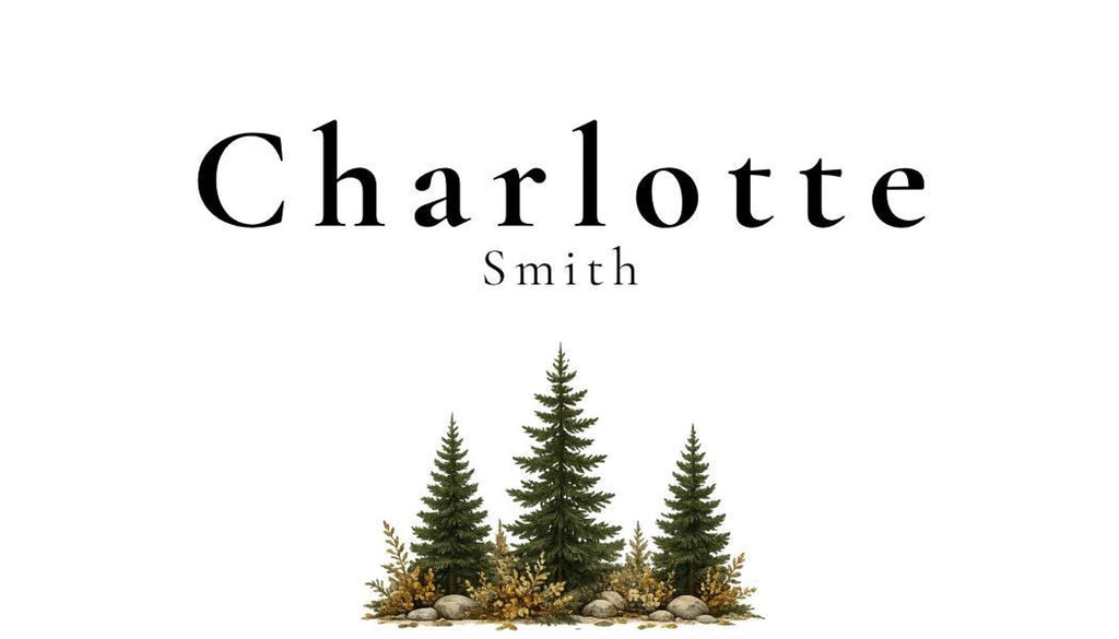 A white place card with the name "Charlotte Smith" in black text, with three green pine trees and brown foliage at the bottom center.
