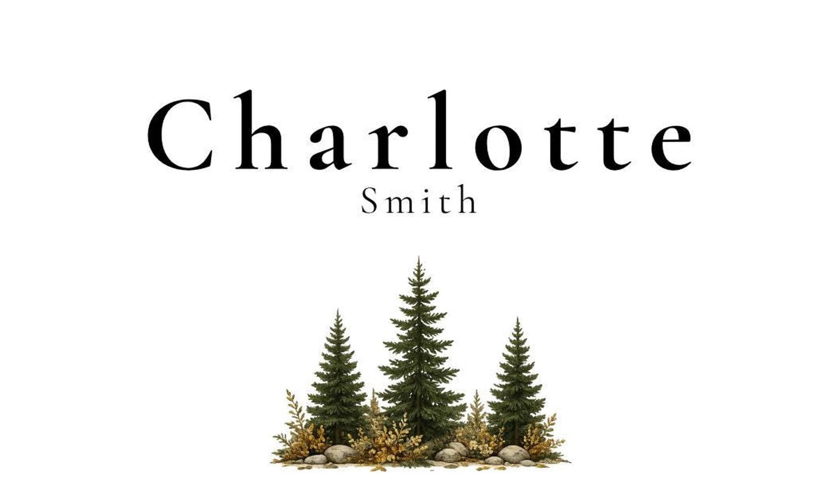 A white place card with the name "Charlotte Smith" in black text, with three green pine trees and brown foliage at the bottom center.
