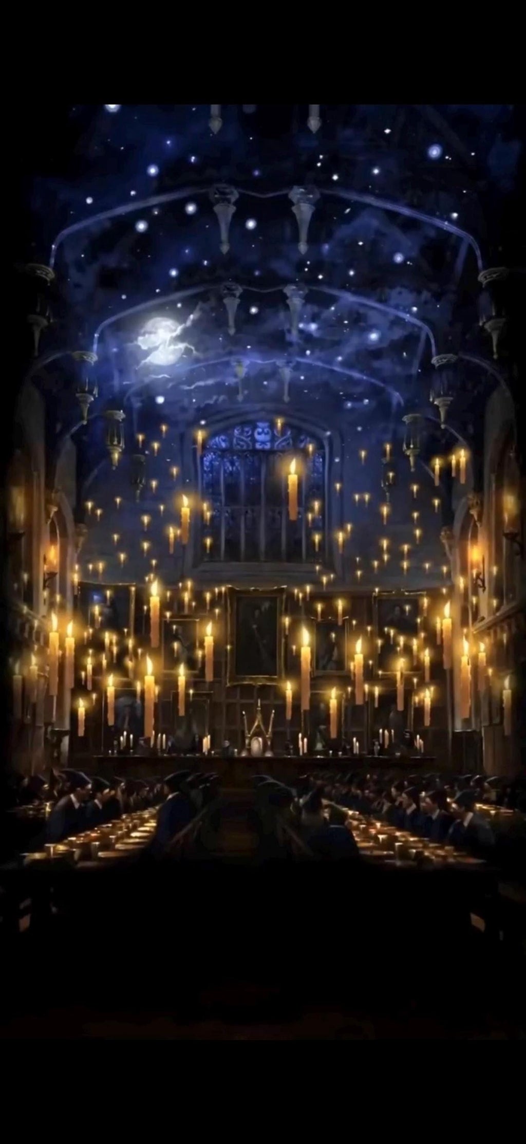 A dark, grand hall with a high, starry ceiling and hundreds of floating lit candles, with long tables and benches below.