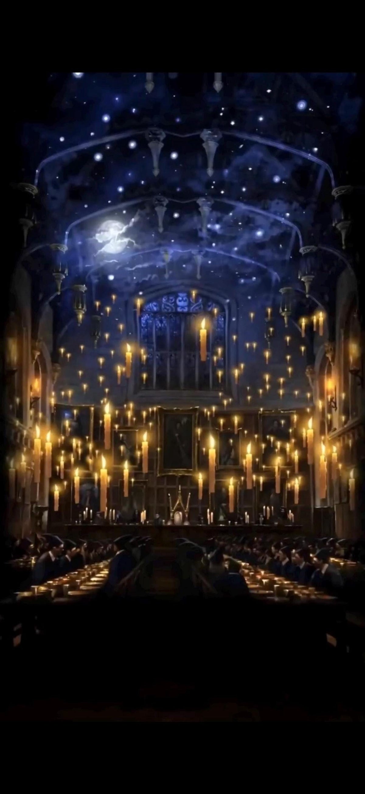 A dark, grand hall with a high, starry ceiling and hundreds of floating lit candles, with long tables and benches below.