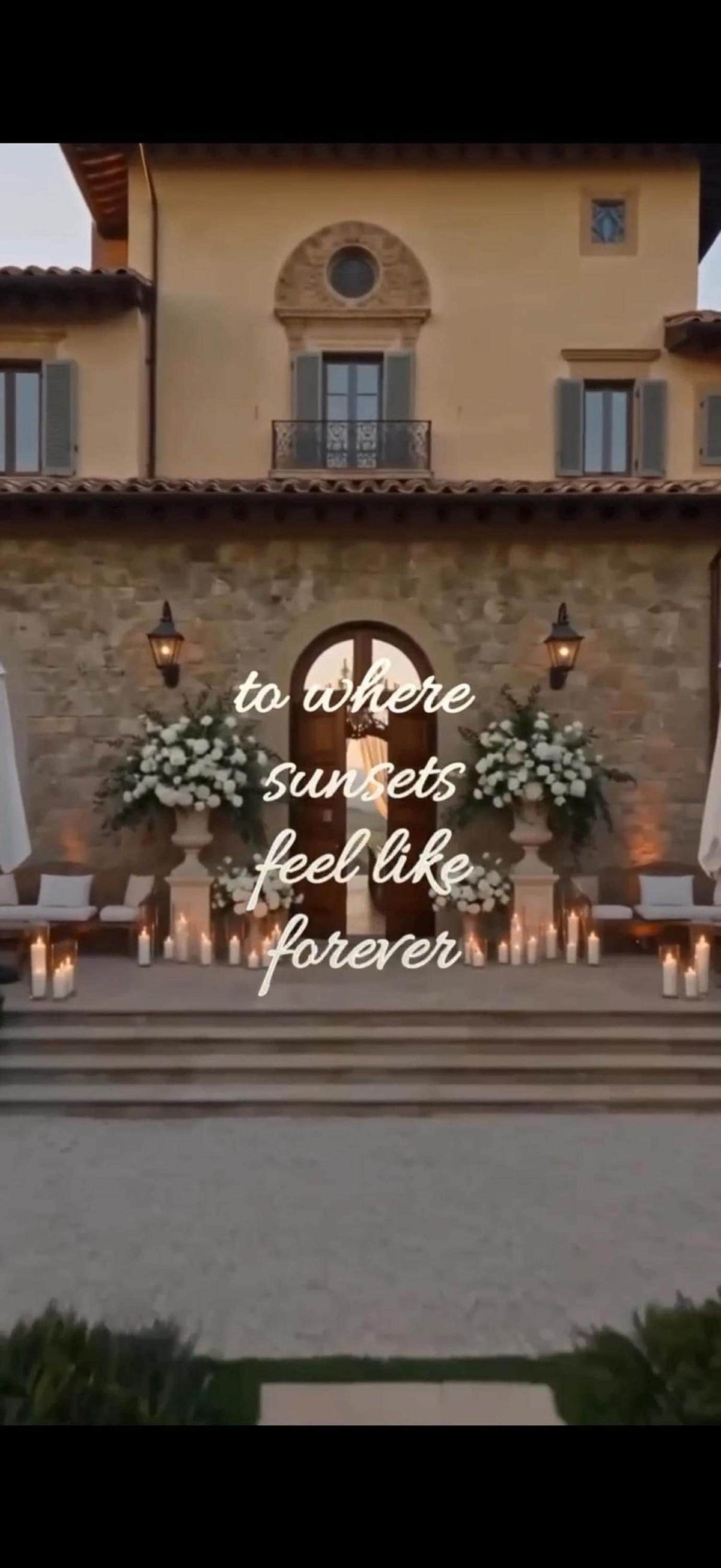 A stone patio with white floral arrangements and candles in front of a villa, with "to where sunsets feel like forever" text overlaid.