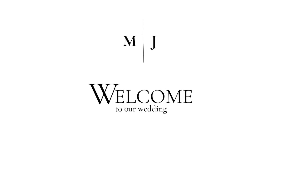 A white card with black text reading "M J" at the top and "Welcome to our wedding" below.