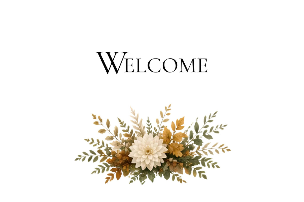 A white card with black text reading "Welcome" above a floral arrangement of white, yellow, and green leaves and flowers.