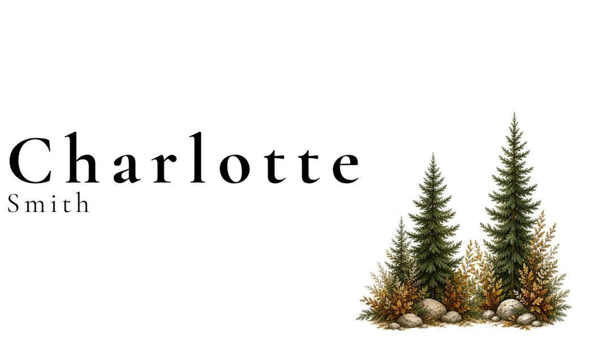 A white place card with the name "Charlotte Smith" in black text, with two green pine trees and brown foliage at the bottom right.